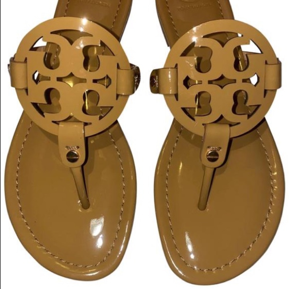 Brown Tory Burch patent leather sandal.